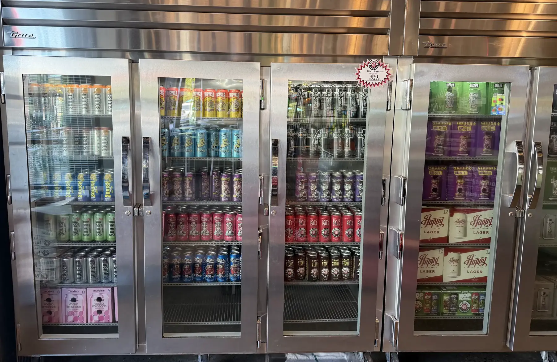 Fridges of Parallel 49 cans in the retail store — Craft Lager, Craft Pale, Jerkface 9000, Squish and more